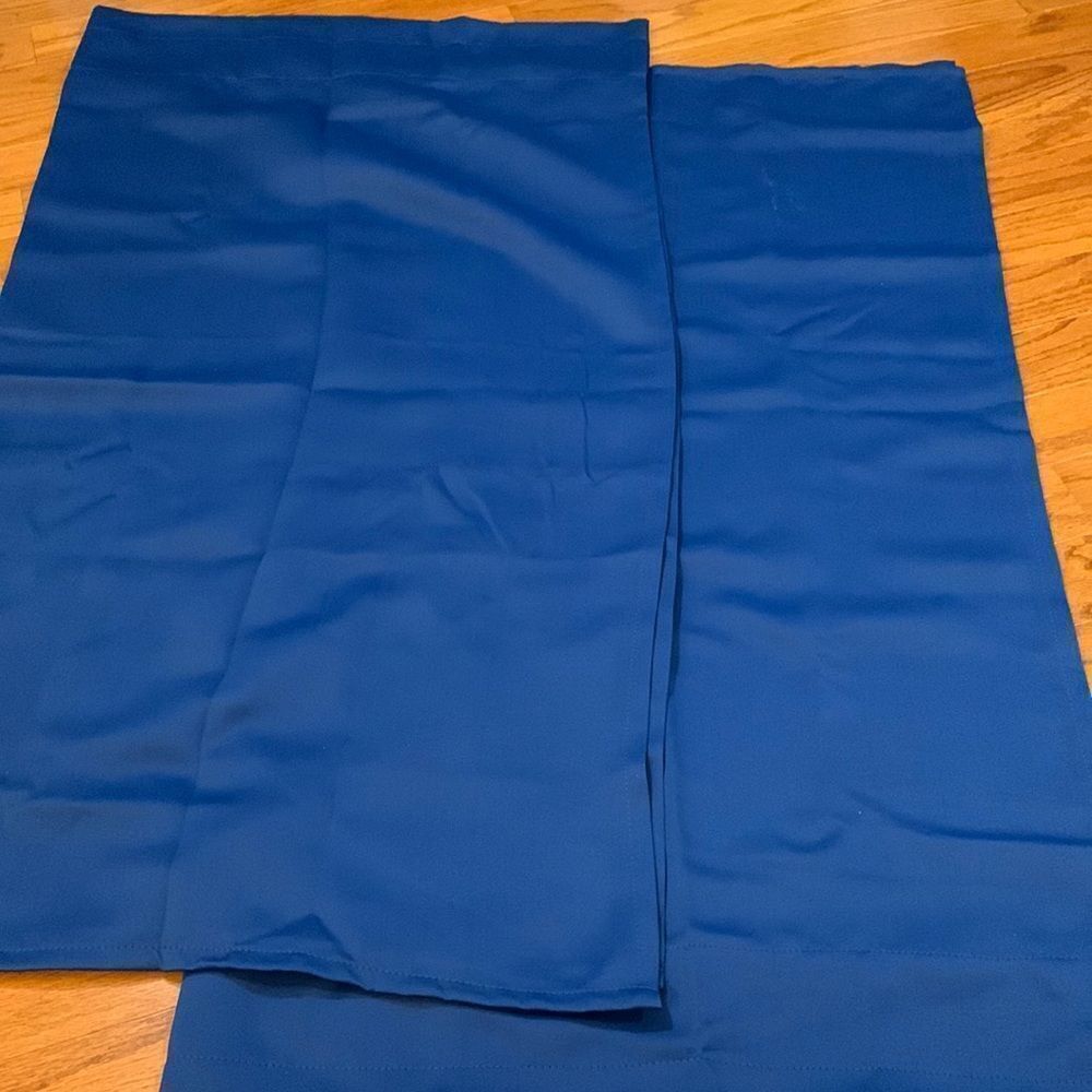 One pair of curtains 44” length 50” wide (for a total of 100” in width). NWT